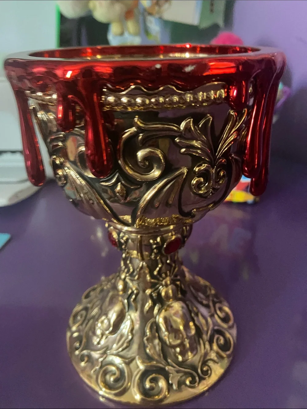 Ornate Gold Chalice Candle Holder with Red Drip Accent